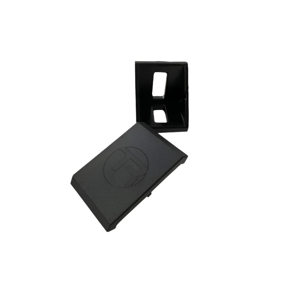 Trak Racer 40mm corner bracket, top-down view — slotted bracket beside ABS end cap