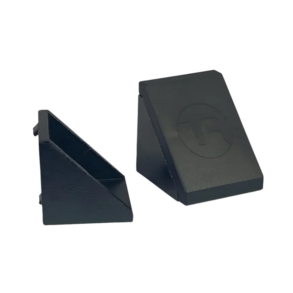 Trak Racer 40mm corner bracket pair, side by side — bare aluminium bracket and TR-branded cap