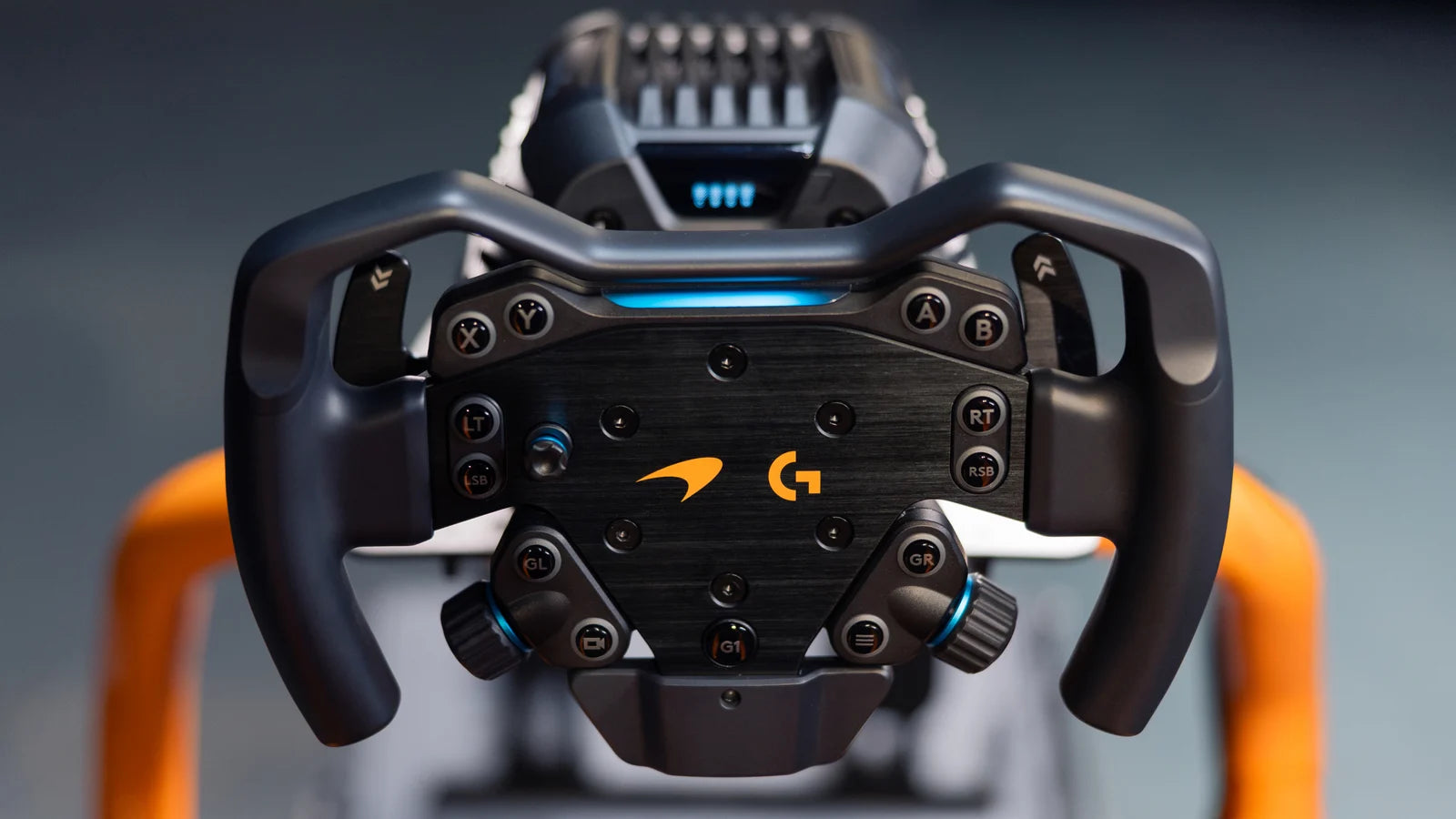 Logitech G RS Formula Wheel McLaren Racing Edition mounted on the RS Wheel Hub in a sim racing cockpit