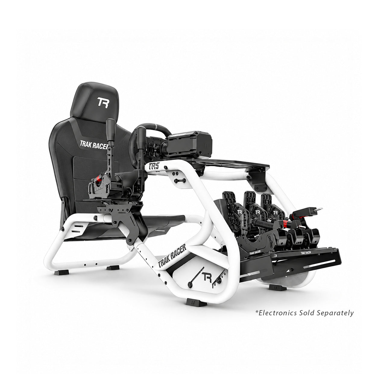 Trak Racer TR5 racing simulator cockpit in white, front right three-quarter view, fitted with wheel, pedals, shifter and handbrake