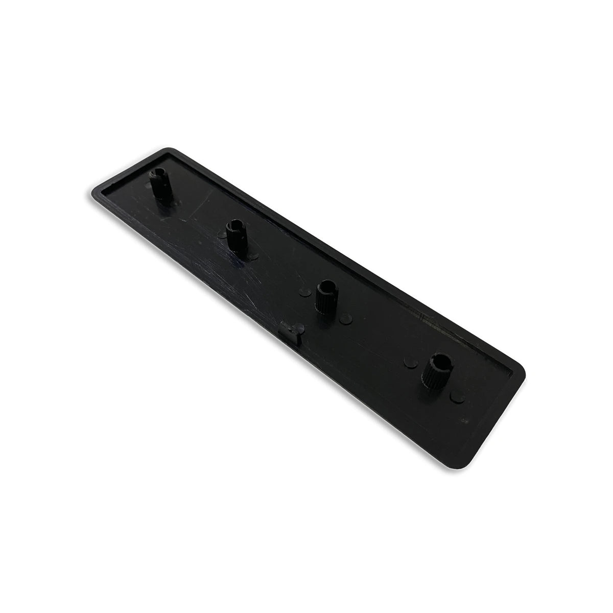Trak Racer 160x40mm profile end cap, rear view showing four moulded push-fit pegs
