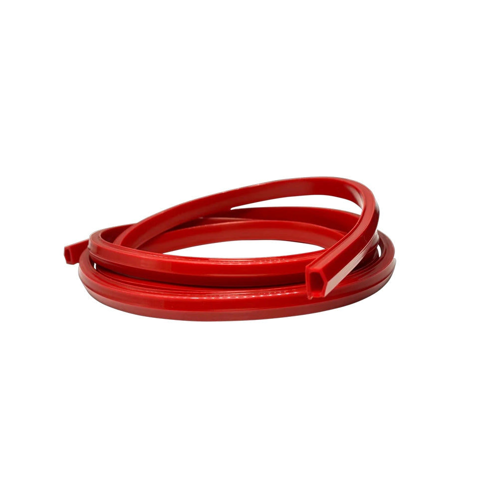 Trak Racer Rubber Strip in red, coiled to show the U-channel profile