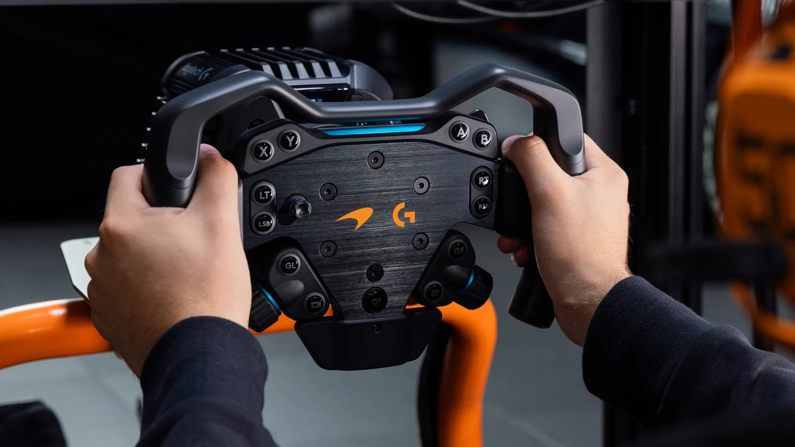Logitech G RS Formula Wheel McLaren Racing Edition on the RS Wheel Hub showing the blue rev LED strip and magnetic paddle shifters on the hub