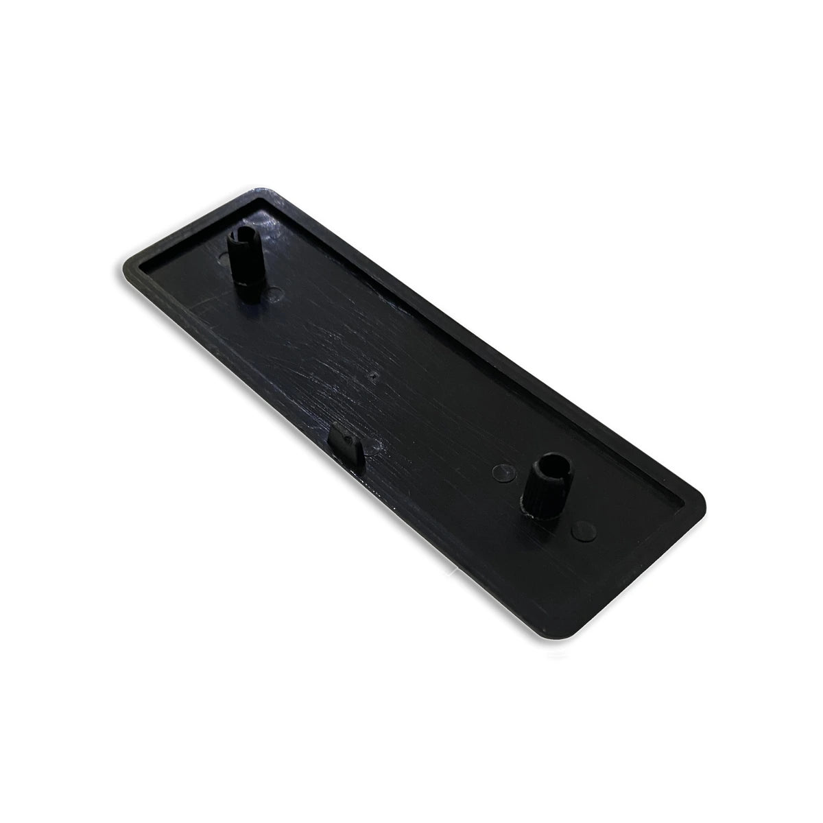 Trak Racer 120x40mm profile end cap, rear view showing moulded push-fit locating pegs