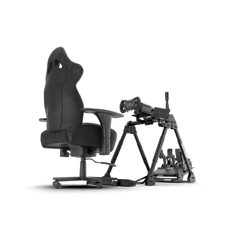 Trak Racer FS3 V2 Wheel Stand side profile with wheelbase, pedals and shifter fitted next to an office chair