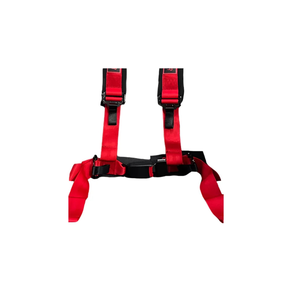 Trak Racer seat harness, red, close-up on the quick-release buckle and shoulder strap labels