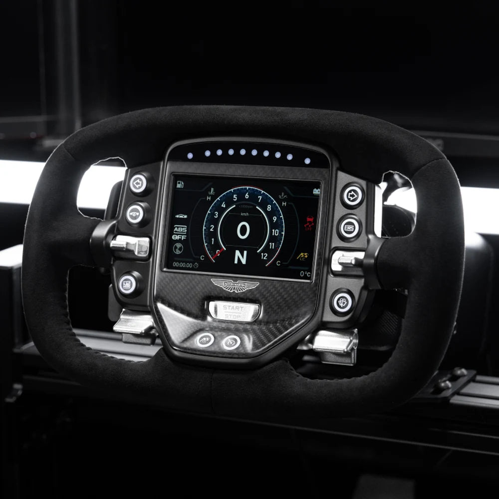 Simagic Aston Martin Valkyrie steering wheel fitted to a sim rig, dashboard lit, on a dark background